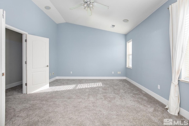 unfurnished bedroom featuring ceiling fan, light colored carpet, and lofted ceiling