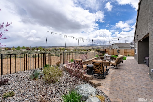 view of patio featuring a fire pit