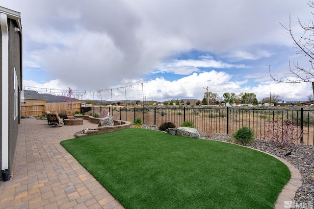 view of yard with a patio and a fire pit