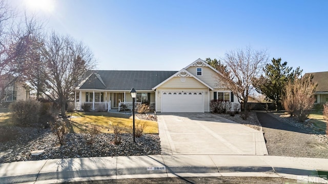 view of front of property featuring a porch and a garage