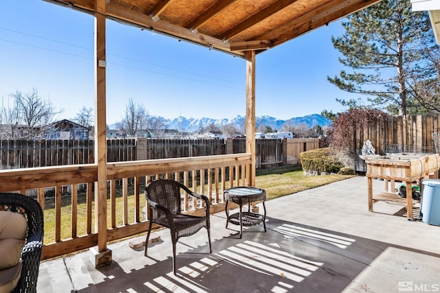 view of patio / terrace with a mountain view