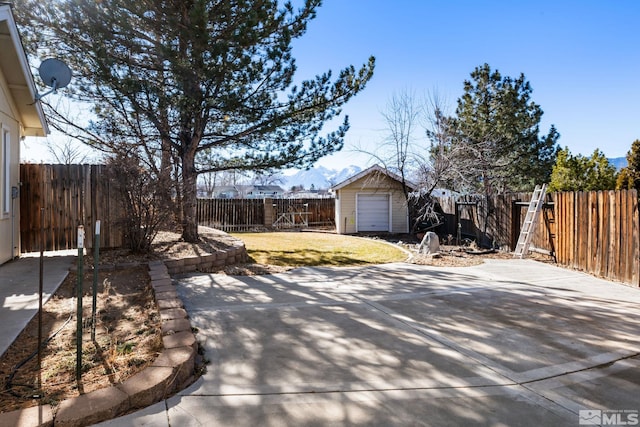 view of patio featuring an outbuilding