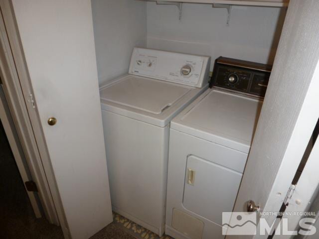 laundry area with washing machine and dryer