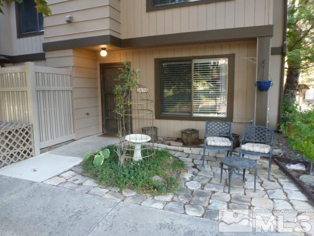 property entrance with a patio area