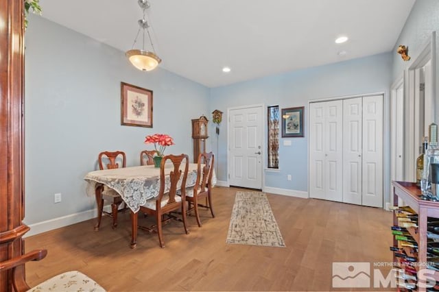 dining space with light wood-type flooring