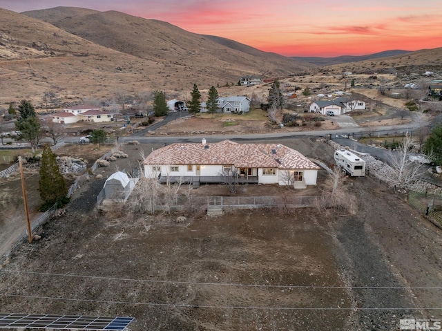 aerial view at dusk with a mountain view