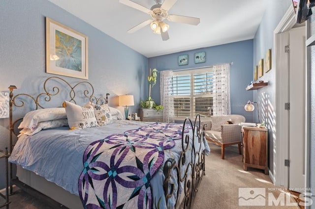 carpeted bedroom with ceiling fan