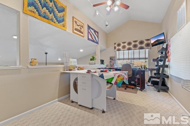 office featuring light carpet, rail lighting, vaulted ceiling, and ceiling fan