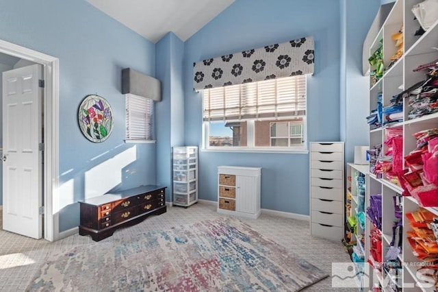 carpeted bedroom featuring lofted ceiling