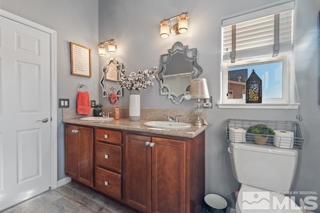 bathroom with vanity and toilet