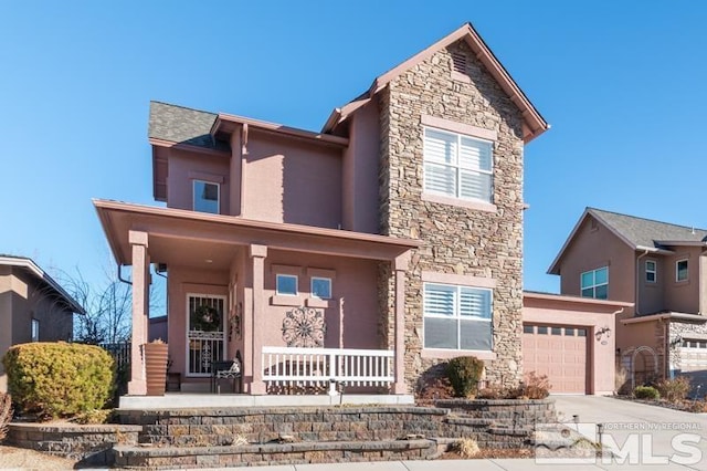 view of front of home with a garage and covered porch