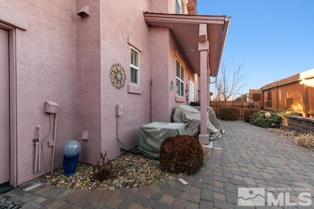 view of property exterior featuring a patio