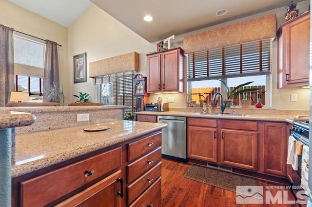 kitchen with dark hardwood / wood-style floors, sink, stainless steel appliances, and a wealth of natural light