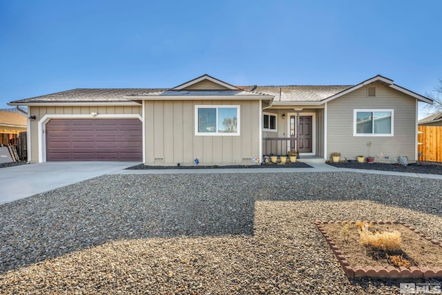 single story home with covered porch and a garage