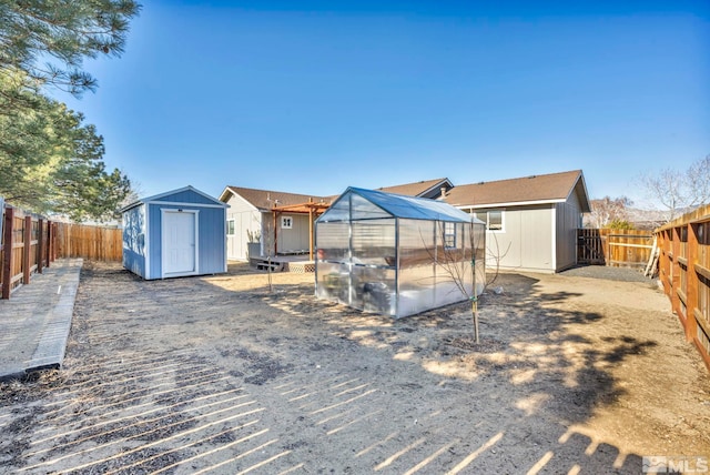 rear view of house with an outdoor structure