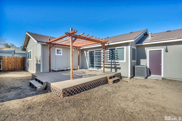 back of house with cooling unit, a deck, and a pergola