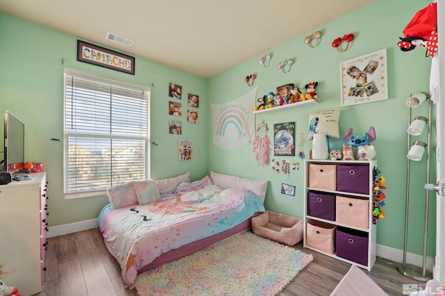 bedroom featuring hardwood / wood-style flooring