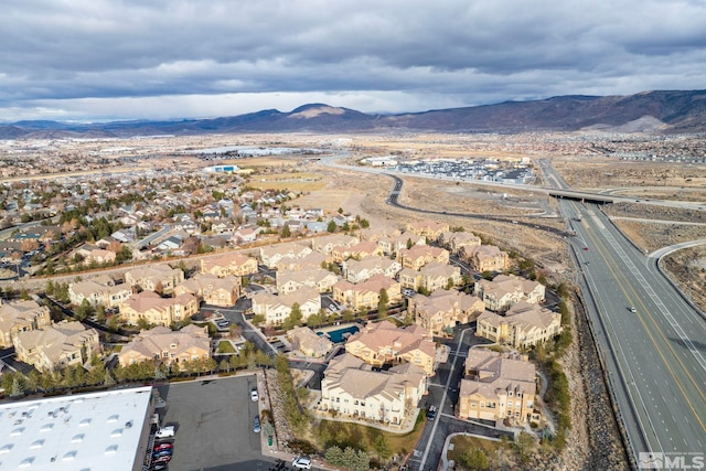 birds eye view of property featuring a mountain view