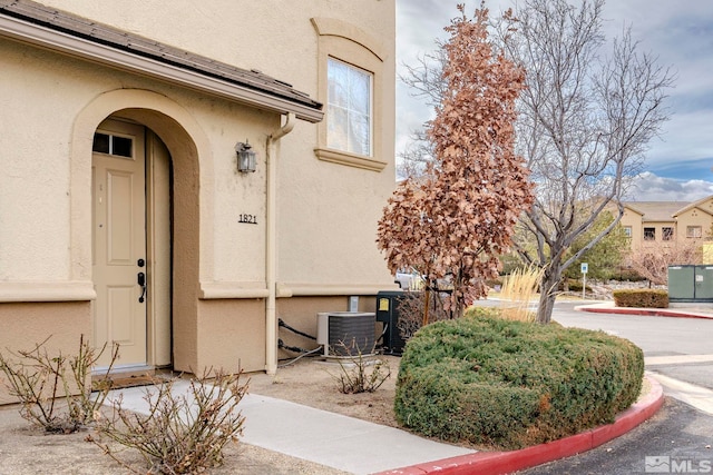 property entrance with central air condition unit