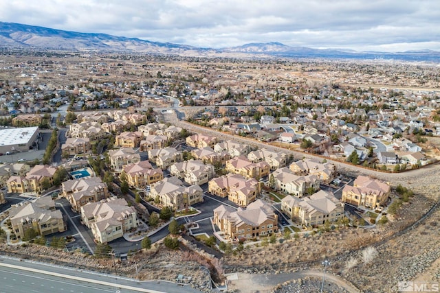 birds eye view of property with a mountain view