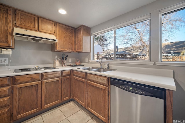 kitchen featuring sink, white gas stovetop, stainless steel dishwasher, a mountain view, and light tile patterned floors