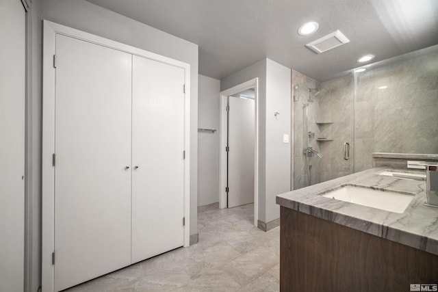 bathroom with vanity and an enclosed shower