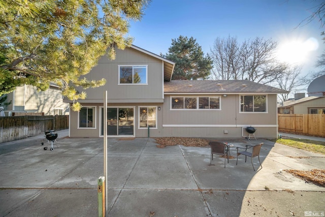 rear view of property featuring a patio area