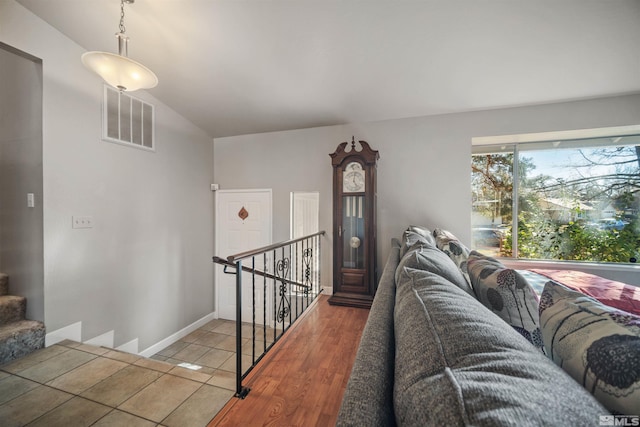 living room featuring light hardwood / wood-style floors and lofted ceiling