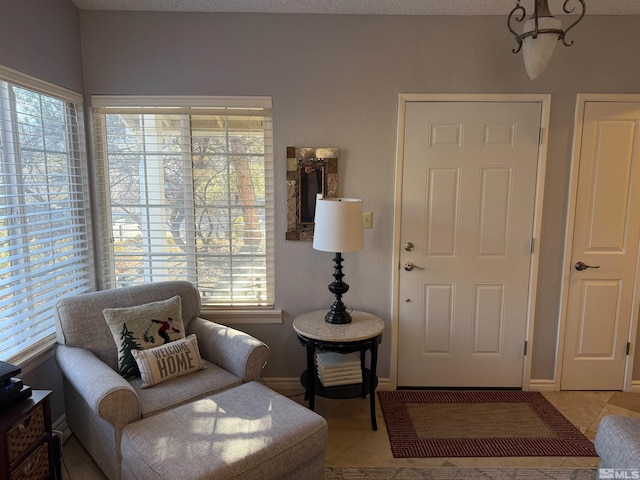 sitting room with light tile patterned floors