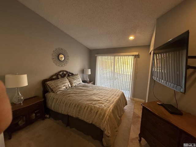 bedroom with access to exterior and a textured ceiling