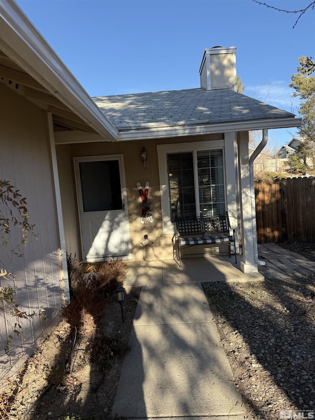 entrance to property featuring a porch