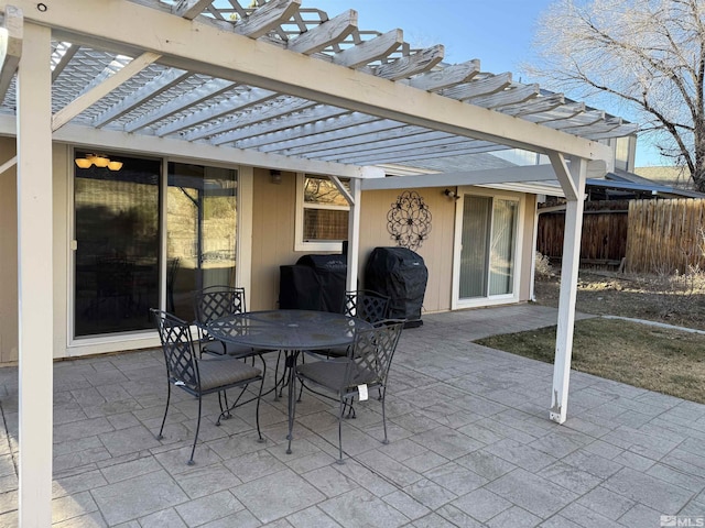 view of patio / terrace with a grill and a pergola