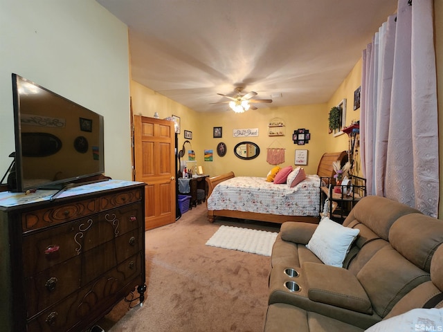 bedroom featuring light carpet and ceiling fan