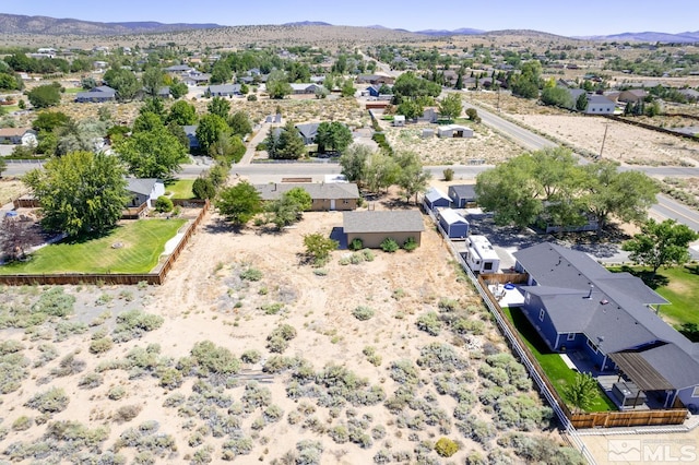 birds eye view of property featuring a mountain view