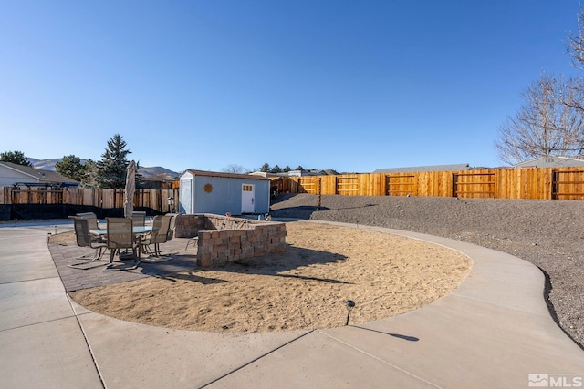 view of front of home featuring a patio and a shed