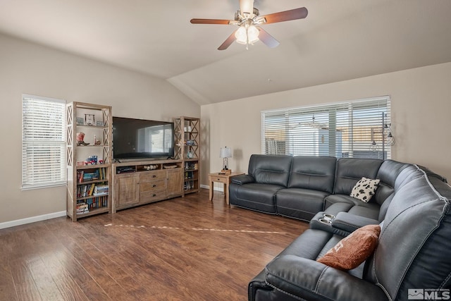 living room with ceiling fan, dark wood-type flooring, and vaulted ceiling