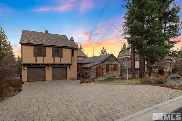 view of front of property with a garage