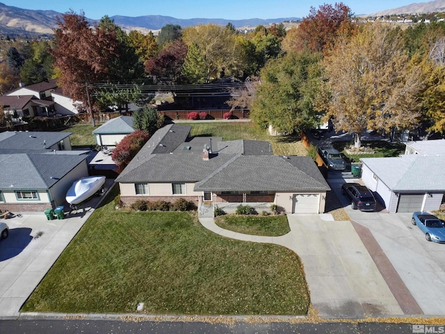 birds eye view of property featuring a mountain view