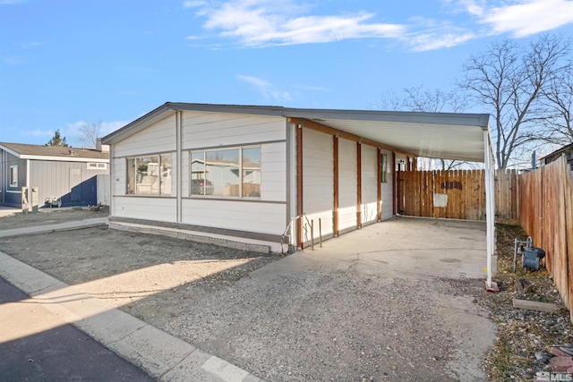 view of front of home featuring a carport