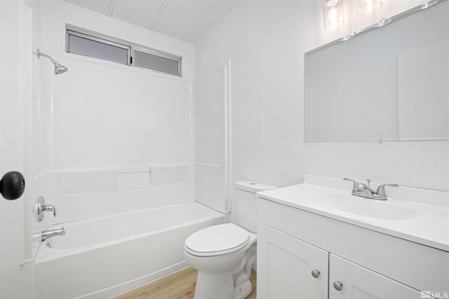 full bathroom featuring vanity, wood-type flooring,  shower combination, and toilet