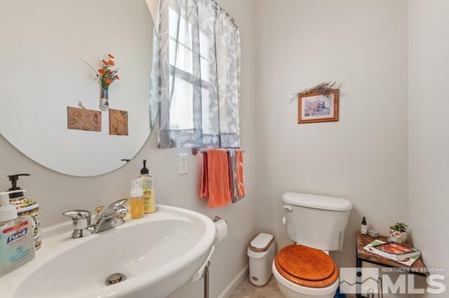 bathroom with sink and toilet