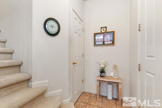 interior space featuring light tile patterned floors