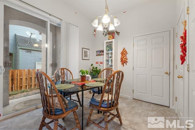 dining room featuring a notable chandelier