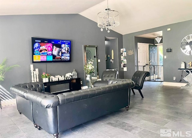 living room with lofted ceiling and a chandelier