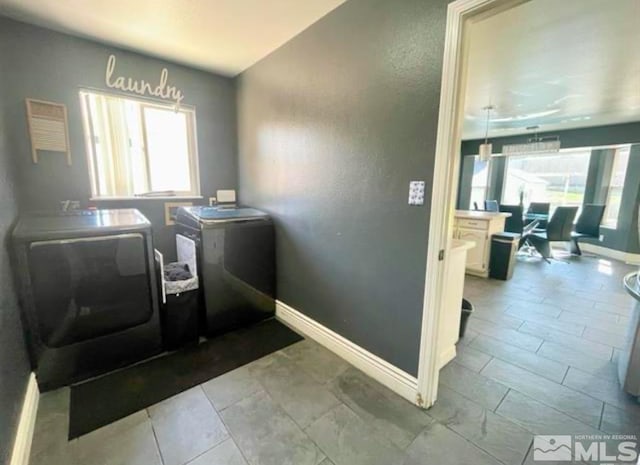 washroom with washer and clothes dryer