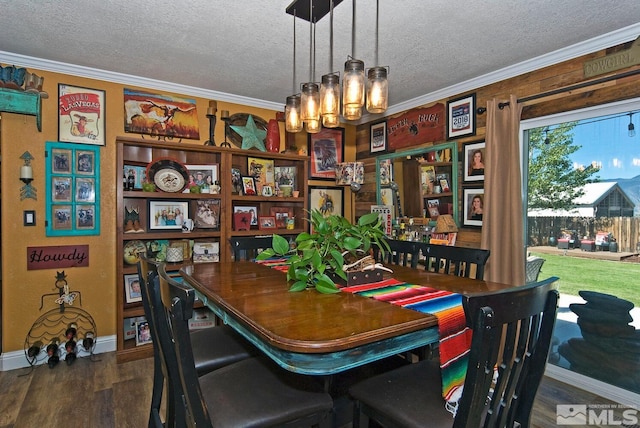 dining space with crown molding, dark wood-type flooring, a textured ceiling, and an inviting chandelier