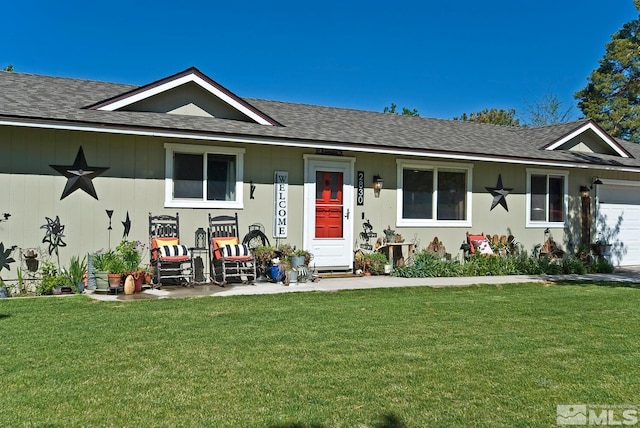 ranch-style home featuring a garage and a front yard