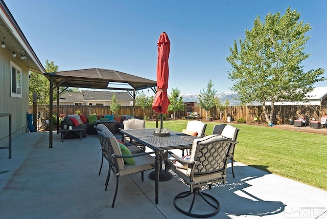 view of patio with outdoor lounge area and a gazebo