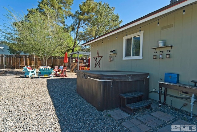 view of yard with a hot tub