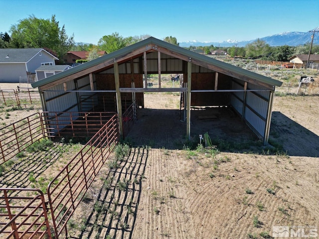 exterior space featuring a mountain view and an outbuilding